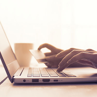 Woman doing online shopping with a credit card