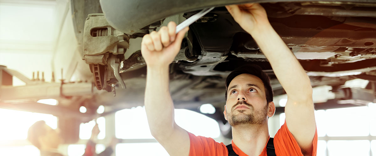 Car mechanic upkeeping car