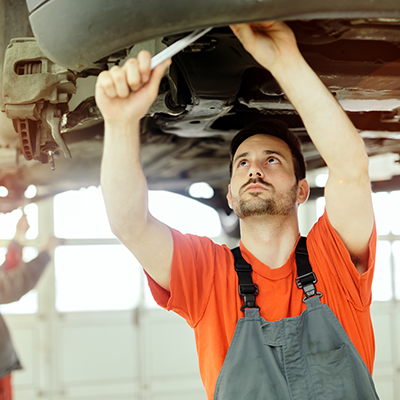 Car mechanic upkeeping car