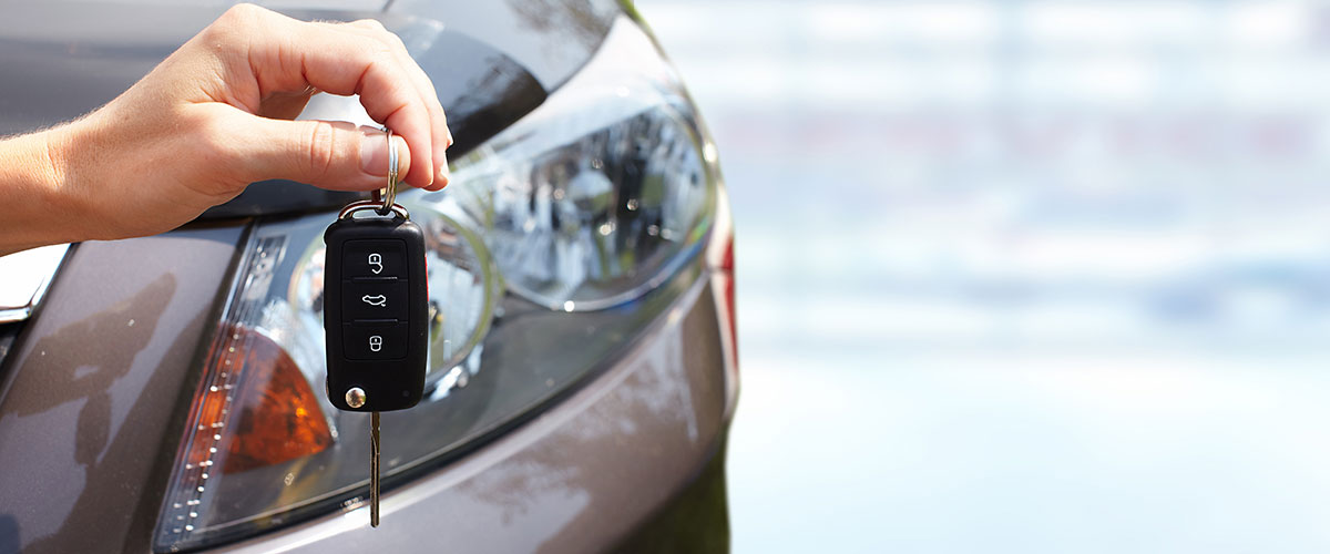 Hand with a car key.